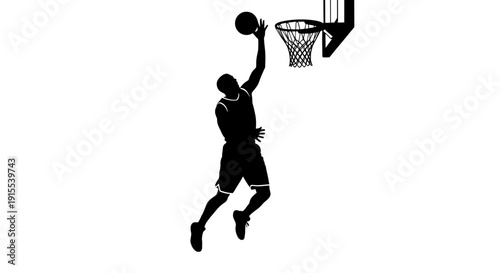 Silhouette of a basketball player dunking the ball.