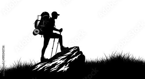 Silhouette of a determined hiker standing on a rock with trekking poles.