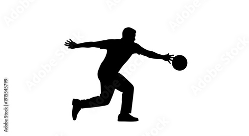 Silhouette of a male bowler in action delivering a bowling ball.