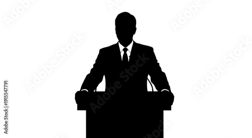 Silhouette of a speaker at a podium delivering a speech.