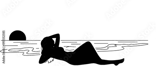 Black silhouette of a relaxed person sunbathing by the ocean at sunset
