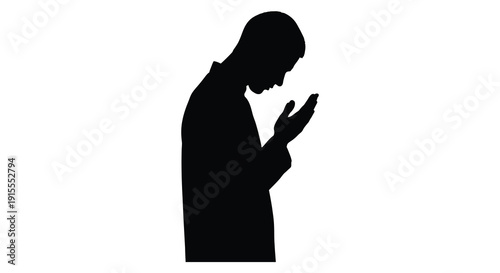 A solitary figure depicted in a stark black silhouette appears to be praying or contemplating hands clasped in a moment of quiet reflection