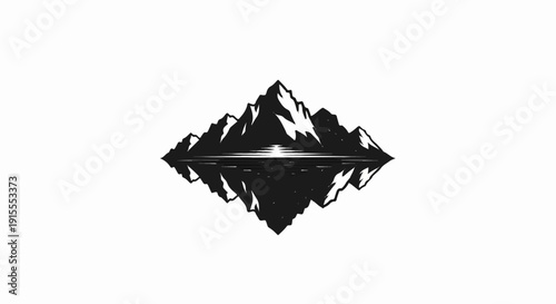 Black silhouette of jagged mountains reflected in water