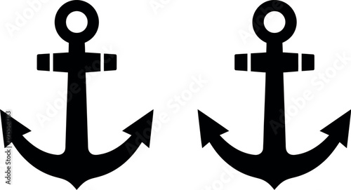 Two classic black and white nautical anchors facing opposite directions