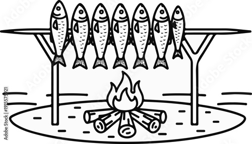 Fish being roasted over a campfire on a spit