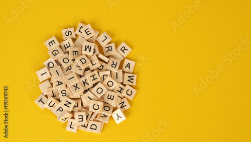 wooden cube words game isolated on yellow background