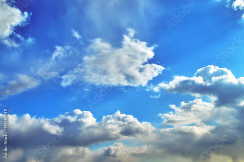 Bright blue skies with fluffy white clouds