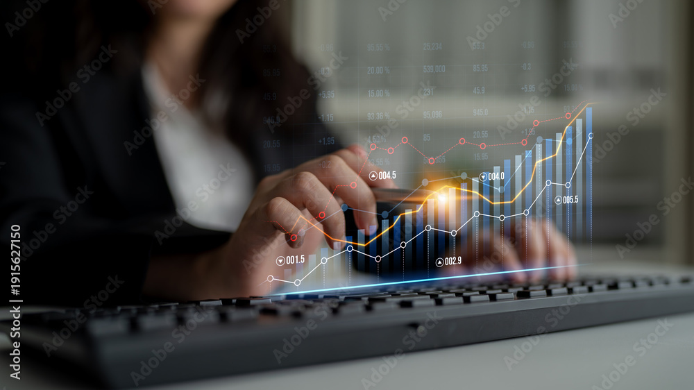 Fototapeta premium A business professional engages with digital graphs and charts while analyzing data trends on a keyboard in an office setting, showcasing financial growth. Scalp