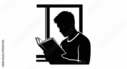 Silhouette of a person focused on reading a book
