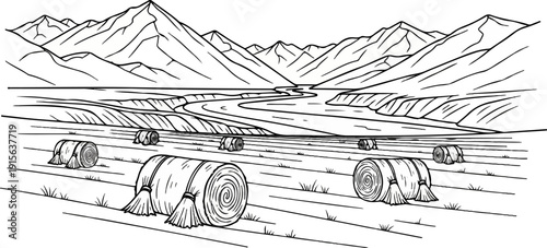 Rolling hay bales in a field with mountains and a river in background