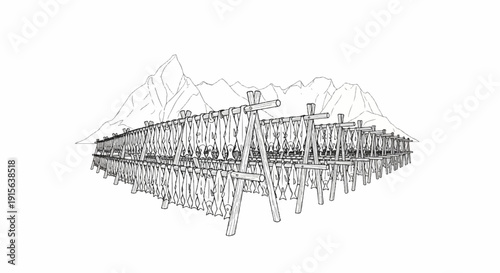 Rows of fish hanging to dry on wooden racks with mountains in background