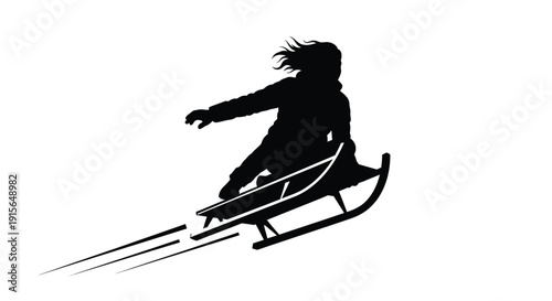 Child sledding down a hill in a striking black silhouette