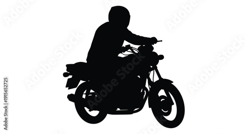 Motorcyclist riding a bike in a stark black silhouette
