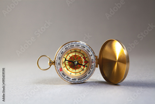 Compass on the white background. Focus on the front compass.