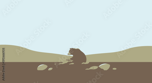 A Lonely Grizzly Bear Sits Amidst Rocks on An Earthy Landscape Under Light Blue Sky