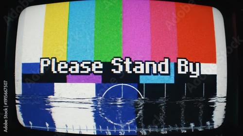Vintage TV screen with Please Stand By message on colorful test pattern
