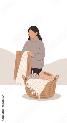 Cozy Home Comforts A Woman Arranges Soft Textiles In A Woven Basket