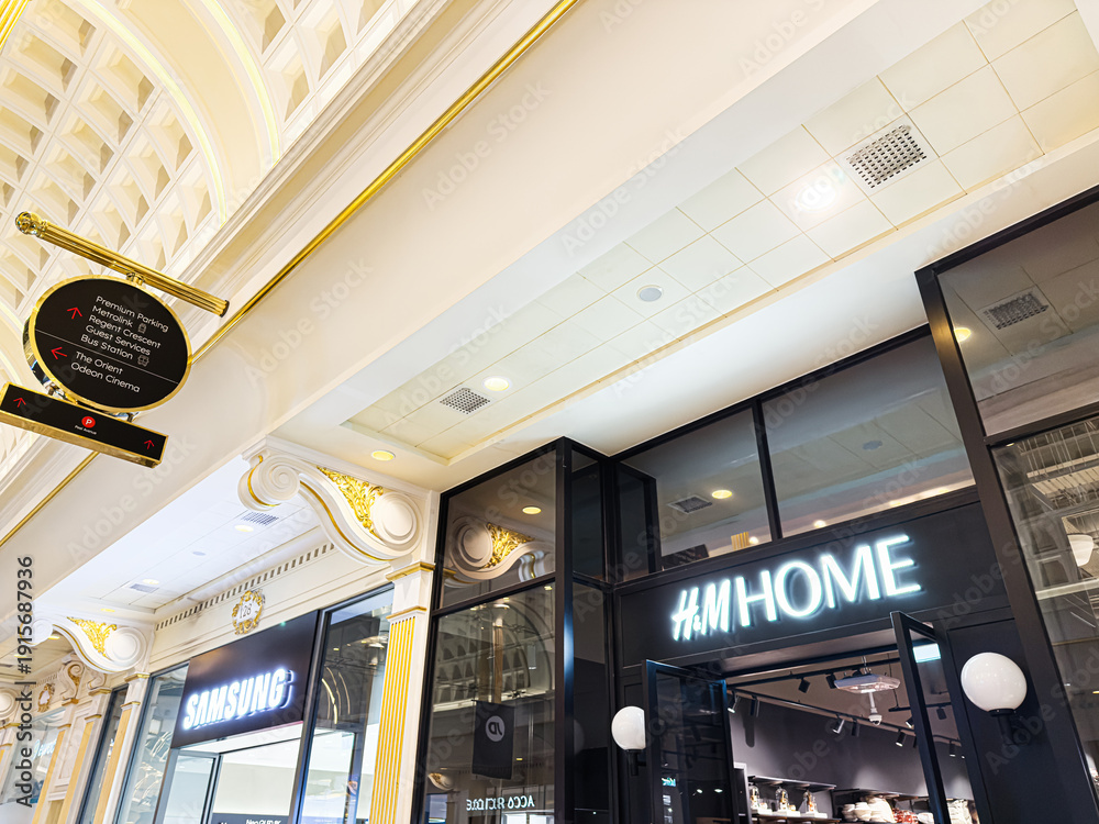 Fototapeta premium Luxurious shopping arcade interior at The Trafford Centre Manchester featuring Samsung and H M Home stores