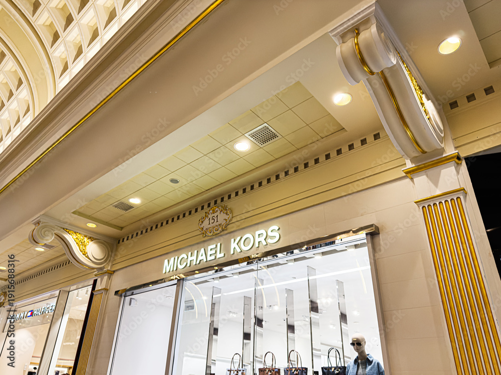 Fototapeta premium Luxurious fashion Michael Kors store at The Trafford Centre, Manchester, UK showcasing handbags and mannequins