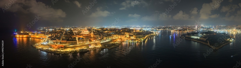 Obraz premium Night aerial of Valletta and Grand Harbour - Valletta, Malta