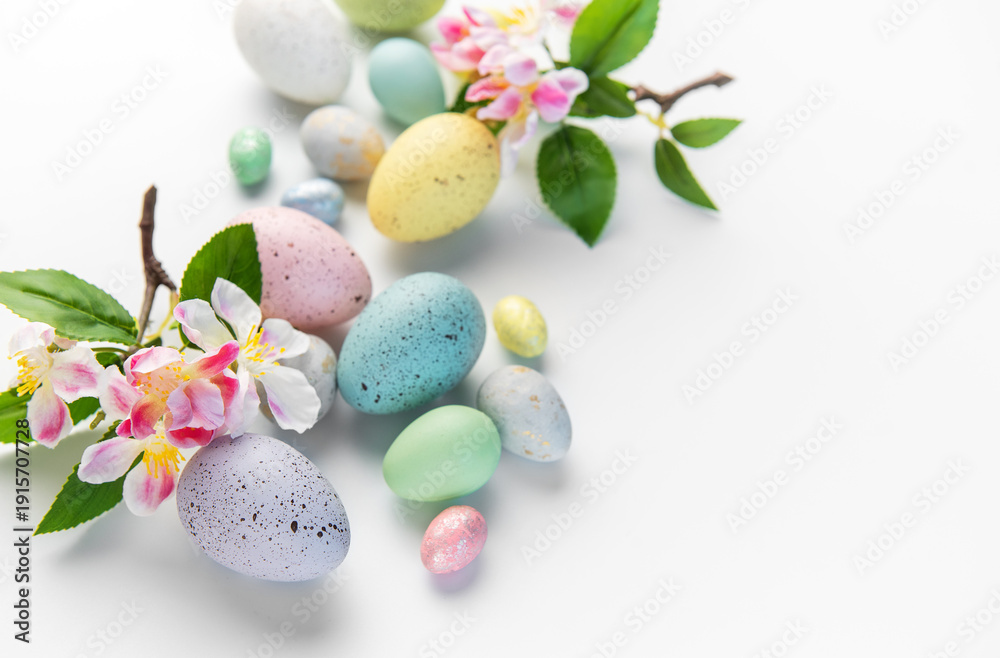 Fototapeta premium Pastel colored eggs and plum blossoms for easter