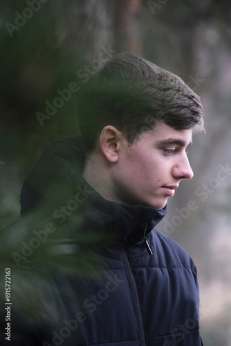 Male in black winter jacket. Smiling young guy