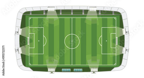 An overhead view of a brightly illuminated football stadium with a green field, white markings, and goalposts.