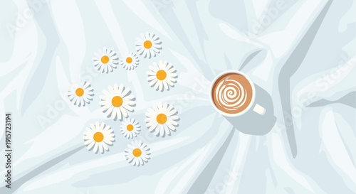 A white cup of coffee with a spiral design sits next to a cluster of white daisies on a textured, rumpled white sheet.