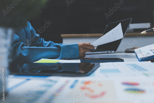 Auditor and accountant team working in office, analyze financial data and accounting record with calculator. Accounting company provide finance and taxation planning for profitable cash flow.