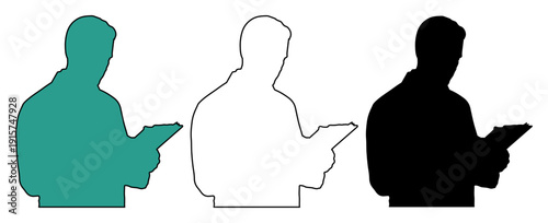 Focused person in silhouette using a tablet device for work or study