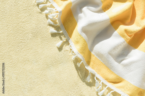 Canvas-taulu Yellow Beach Towel with Striped Fabric and Tassels
