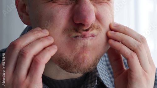 puffed-out cheeks on his face.
The man holds his breath for a long time.
A mouthful of air