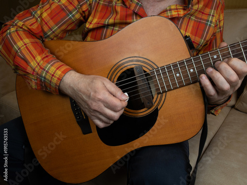 Playing acoustic guitar