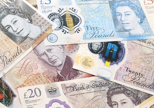 Wallpaper Mural British pound money bills pile on table. United Kingdom banknotes of GBP currency close up. Concept of business, economy and investment in United Kingdom Torontodigital.ca