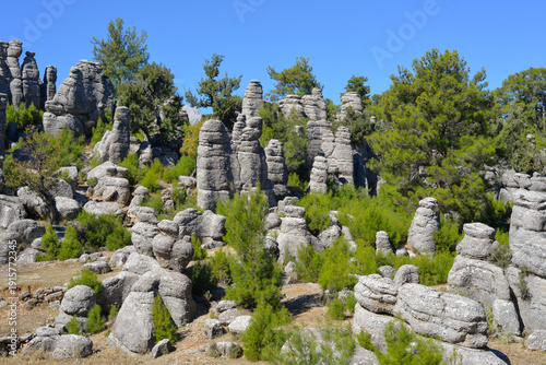 Majestic view of the valley with beautiful rock formations on an autumn day. They look like several standing men, so people called them 
