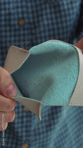 A man opens an empty wallet with no money.
The man has run out of money.
The man spent all his money on shopping.