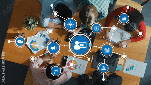 Εκτύπωση καμβά A dynamic team collaborates on marketing strategies, utilizing data visualizations and digital tools to enhance business growth and effectiveness in a modern workspace