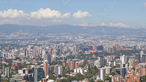 Guatemala metropolis with surrounding volcanic peaks