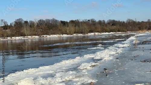 Narew River in winter, close-up of floating ice floes.