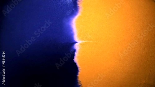 Abstract Blue and Orange Background Texture with Ripples and Light Effects.