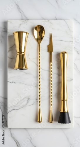 Gold Barware Tools on Marble Surface.