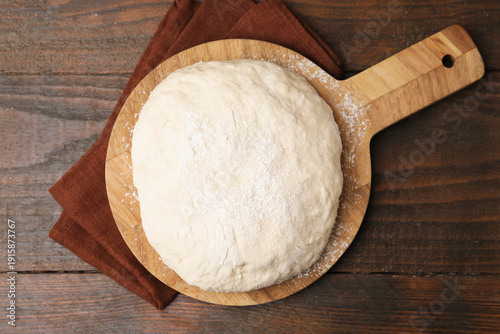 Quadro su tela Fresh yeast dough on wooden table, top view