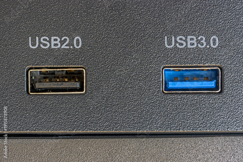 Close-up of USB 2.0 and USB 3.0 ports on a computer panel for connectivity and technical use