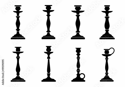 Set of eight black silhouette antique style candle holders on a clean white background, showcasing various classic designs.