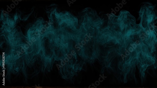 Wispy blue smoke curls and twists against a dark background, creating an ethereal and mysterious atmosphere.