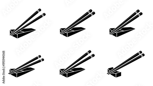 Set of six black and white chopstick rests with chopsticks, isolated on white background