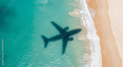 Aerial View of Airplane Shadow Over Tropical Beach with Clear Ocean Waves