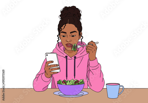 A young Black woman in a pink hoodie eats a salad from a purple bowl while looking at her smartphone.