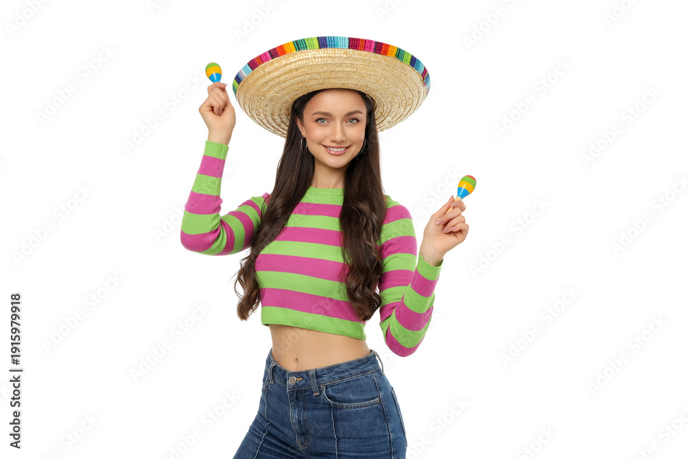 Obraz premium Young woman wearing a sombrero and holding maracas, isolated, PNG