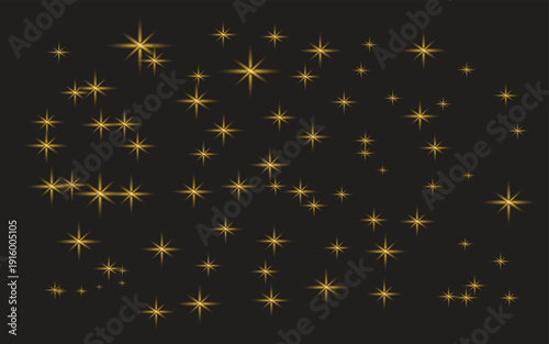 Golden light effect sparkling stars on dark background